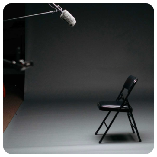Chair in a black room